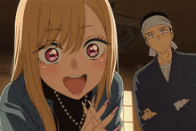 a man with a bandana on his head stands next to a girl with long blonde hair