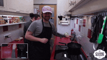 a man in an apron is cooking in a kitchen with a cuire manger logo in the corner