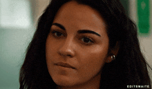 a close up of a woman 's face with editsmaite written in the corner