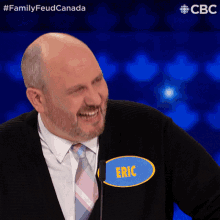 a man wearing a name tag that says eric