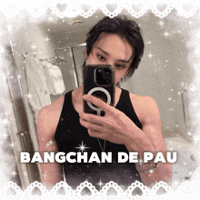a man taking a picture of himself in a mirror with the name bangchan de pau on the bottom