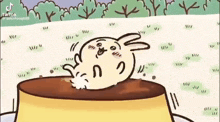 a cartoon rabbit is sitting on top of a pudding cup .