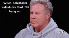 a man wearing a grey hoodie with the words when salesforce calculates that tax bang on above him