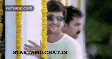 a couple of men standing next to each other with the words starttamilchat.in on the bottom right