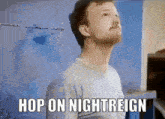 a man in a white shirt is standing in front of a blue wall and says hop on nightreign