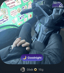 a person is sitting on a motorcycle with a goodnight button