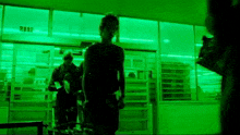 a person walking into a store with the number 2112 on the window