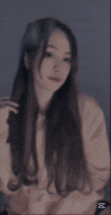 a blurred image of a woman with the caption cap cut