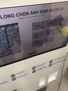 a photo booth with a sign that says please choose the photos to print