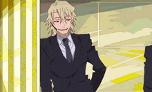 a man in a suit and tie is smiling