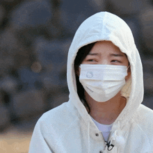 a woman wearing a white hello kitty face mask