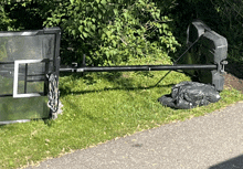 a spalding basketball hoop sits on the grass