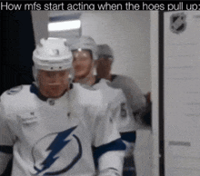 a hockey player wearing a lightning bolt jersey