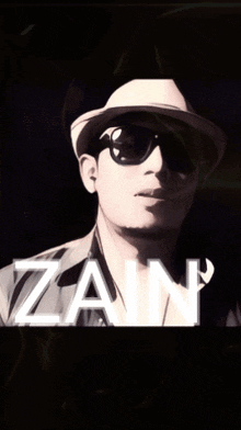 a man wearing a hat and sunglasses with the name zain written below him