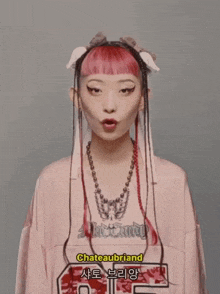 a girl wearing a pink shirt that says chateaubriand on it
