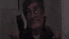 a man with a mask on his face is making a funny face .