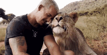 Petting Lion Dean Schneider GIF