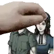 a man and a woman are standing next to each other and a hand is covering the man 's face .