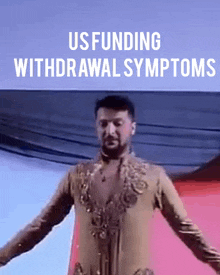a man with his arms outstretched in front of a sign that says us funding withdrawal symptoms