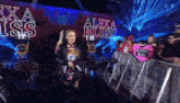 a wrestler named alexa bliss walks down the aisle