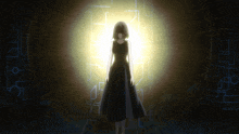 a woman in a black dress is standing in front of a light