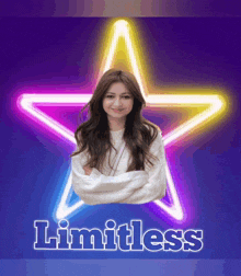 a woman is standing in front of a neon star and the word limitless is on the bottom