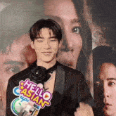 a man in a tuxedo holds a sign that says hello asian