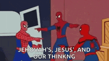 a group of spidermans are pointing at each other in a room .