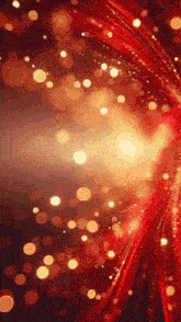 a red and gold background with a lot of sparkles