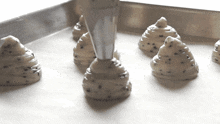 Squeezing The Piping Bag Two Plaid Aprons GIF - Squeezing The Piping Bag Two Plaid Aprons Making The Mochi Bread GIFs