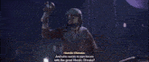 a man with a mask on his face is talking to another man in a dark room