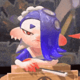 a cartoon character with blue hair and red eyes is sitting on a box