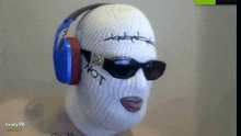 a person wearing headphones and sunglasses with the word not written on their face