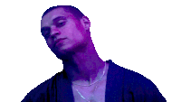 a man is wearing a purple shirt and a necklace