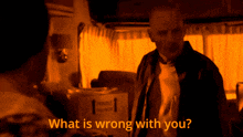 a man stands in front of a fragile box and says what is wrong with you