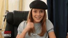 a woman wearing a hat says cool in red