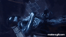 a close up of a person in a venom suit laying on a wooden bench .
