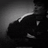 a black and white photo of a man is copyrighted by t4rak