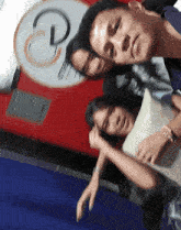 a group of people are posing for a picture in front of a sign that has the letter p.