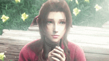 a girl in a red shirt is sitting on a bench with her hands folded in front of flowers .