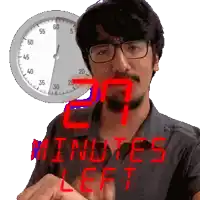a man wearing glasses stands in front of a clock that reads 20 minutes left