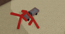 a red toy truck with a wagon attached to it is laying on the ground