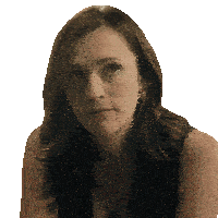 a close up of a woman 's face with a serious look on her face