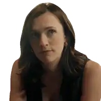 a close up of a woman 's face with a serious look on her face