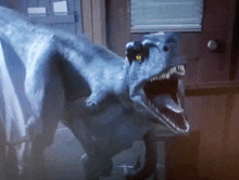 a t-rex with its mouth open is standing in a dark room