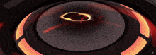 a close up of a circular object with a black hole in the center