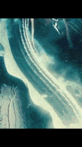 a close up of a water surface with a few waves
