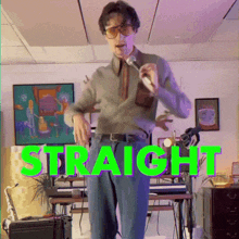 a man singing into a microphone with the word straight in green