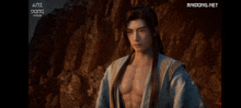 a man with long hair is standing in front of a rocky cliff and the website anidong.net is displayed below him