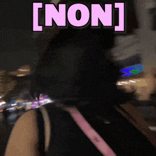 a blurred image of a person with the word [ non ] on it